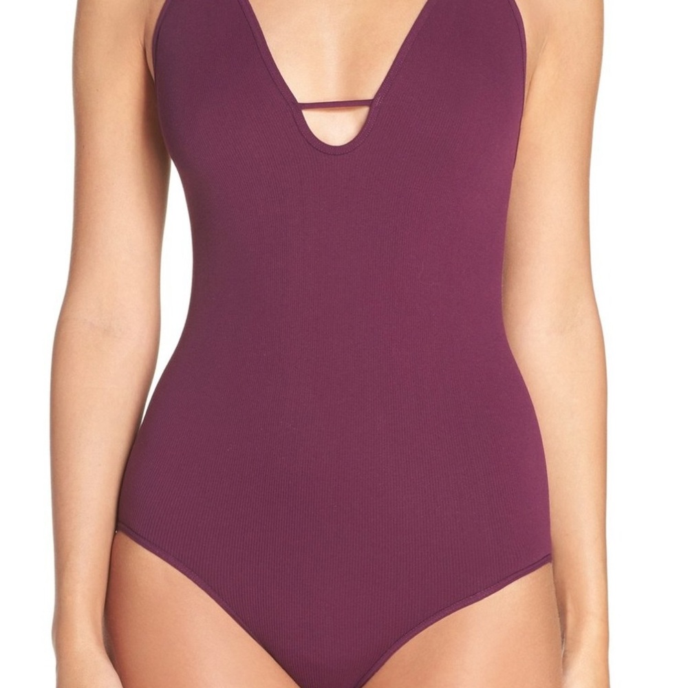 Free people purple bodysuit! Minor piling.